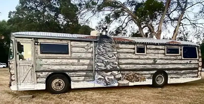 bus painted log cabin