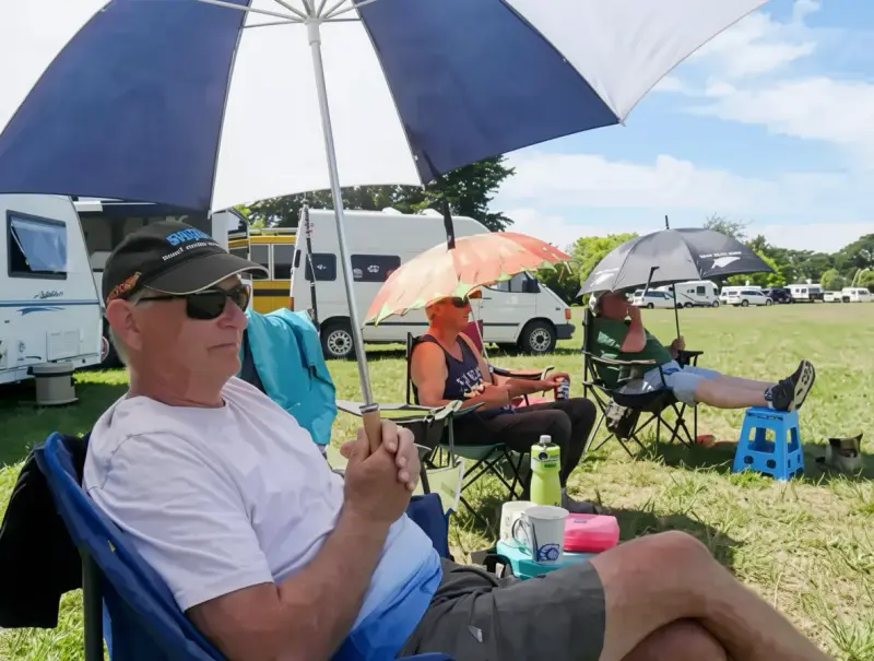 men under umbrellas